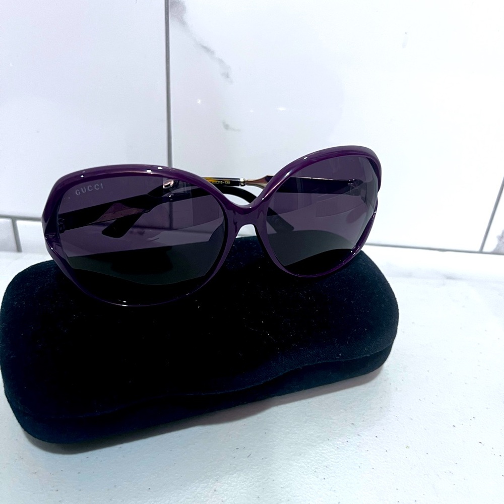Gucci Sunglasses Women with case. Burgundy frames with gold arms. Worn twice.